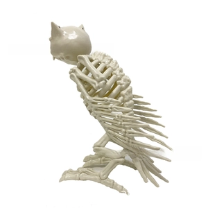 Detailed skeletal owl prop with intricate bone structure for Halloween scene decoration