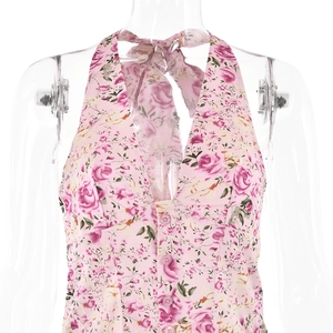 Detail view of pink floral halter top with button front and neck tie on mannequin