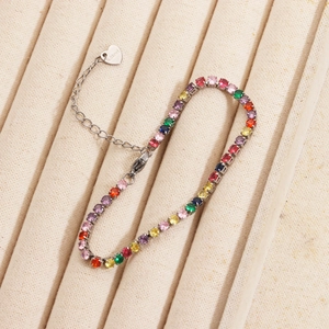 Detail view of colorful zircon tennis bracelet with stainless steel lobster clasp on velvet