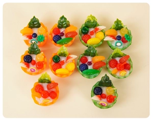 Detailed macro view of 10 miniature resin fruit bowl models with vibrant realistic textures