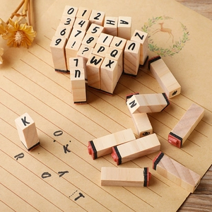 Retro typewriter style wooden alphabet and number stamp set for DIY journaling and crafts