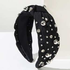 Close-up of black knotted headband with silver metal beads and sparkling rhinestones