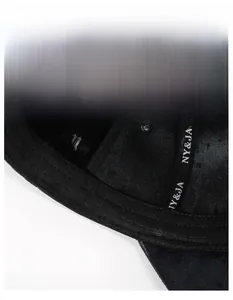 Detail of internal moisture-wicking band and logo straps on the fleece baseball cap