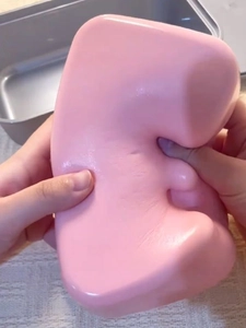 Close-up of pink squishy toy cake showing soft slow rebound material and stress relief texture