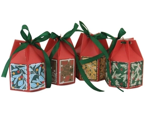 Close-up of hexagonal Christmas gift boxes with festive patterns and green ribbons