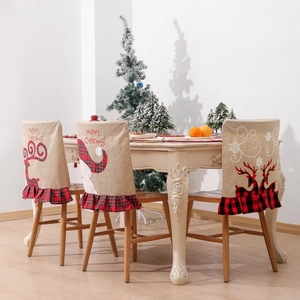 Christmas linen chair covers with Santa and reindeer embroidery for holiday dining decor