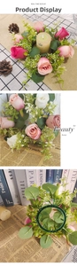 Detail of pink and white silk rose wreath showing floral petals and candle ring base