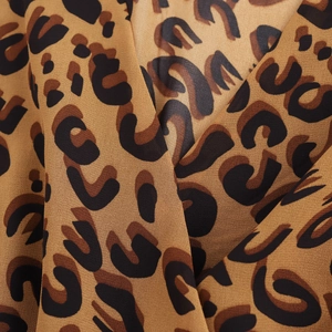 French vintage leopard print dress with V-neck, long sleeves and waist-cinched short skirt