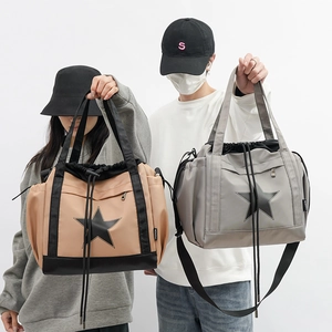 Fashionable nylon tote bags in beige and grey with black star logo and drawstring closure