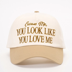 Close-up of high-density embroidery on two-tone cotton baseball cap with text details