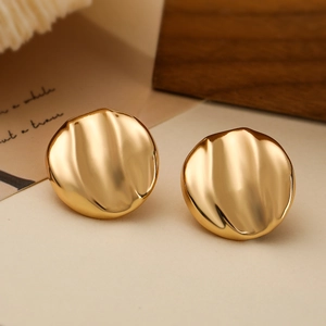 Minimalist 18K gold-plated irregular wavy disc stud earrings on a neutral background