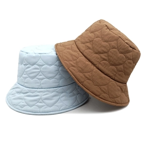 Light blue and brown quilted bucket hats with heart patterns for women in winter
