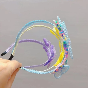 Close-up of sequined lace butterfly headband for girls with intricate wave texture