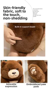 Close-up of soft plush teddy bear fabric with detailed paw embroidery and weighted base