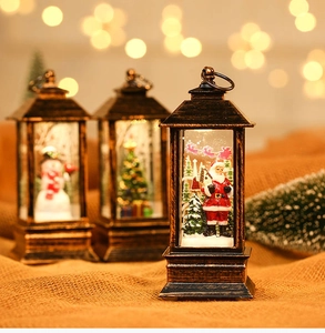 Macro detail of vintage Christmas lantern decor with Santa and snowman figurines