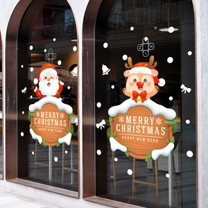 Christmas window decals with Santa and reindeer on arched glass for festive decoration