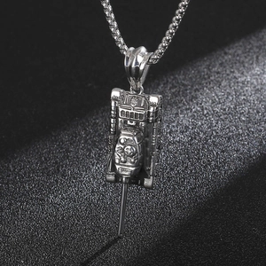 Macro shot of silver stainless steel tank pendant with smooth metallic reflection