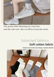Detailed view of striped cotton mid-calf socks in various colors with soft texture