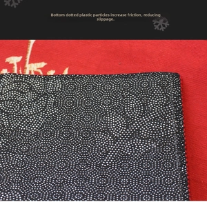 Detail of the non-slip backing with white dots on a black base for a Christmas rug