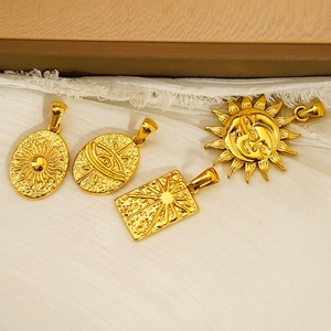 Retro gold stainless steel tarot sun and eye pendants set on white silk fabric