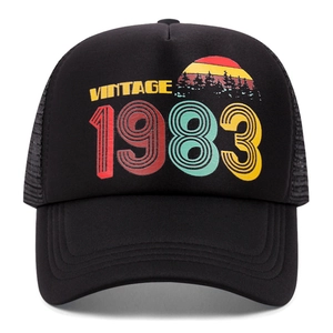 Vintage 1983 printed black trucker hat with breathable mesh and retro sunset graphic