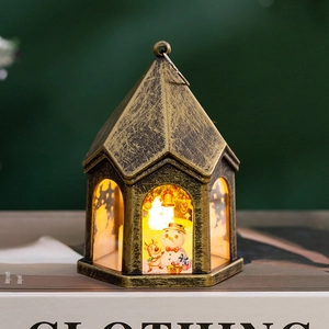 Detail of vintage Christmas LED lantern featuring painted snowman and reindeer design