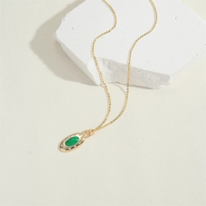 French vintage gold necklace with green oval zircon pendant and delicate chain