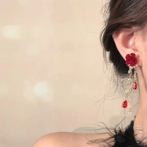 Elegant red velvet rose flower tassel earrings with golden hooks worn by model