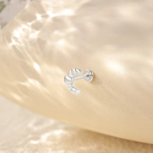 Detail shot of 925 silver earring featuring a visible S925 hallmark on smooth metal finish