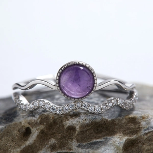 S925 sterling silver ring set featuring purple gemstone and pavé zircon on natural rock