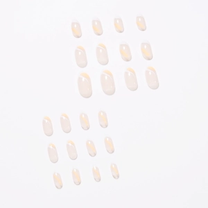 French tip almond fake nails with white edges and yellow stripes on nude base