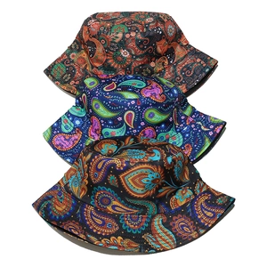 Three paisley print bucket hats in orange, blue, and black for summer sun protection