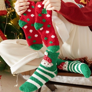 Cozy Christmas coral fleece socks featuring festive polka dots and Santa Claus patterns