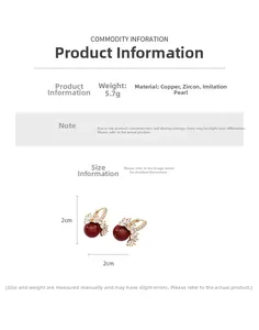 Macro detail of 18k gold plated earring with red pearl, cubic zirconia and dimensions
