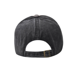 Detail of vintage washed denim baseball cap with adjustable bronze metal buckle back