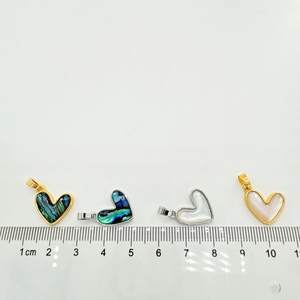 Set of four 18K gold and silver heart pendants with abalone and mother of pearl inlay