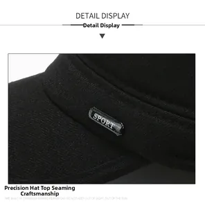Detail view of stitched black fabric crown and metallic silver SPORT plaque on casual cap