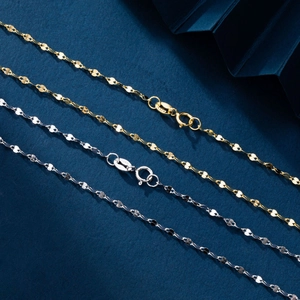 Detail of minimalist S925 sterling silver chain in gold and silver finishes