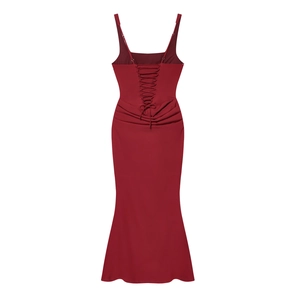 Close-up of backless lace-up detail and cross strap design on dark red mermaid dress