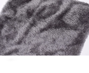 Macro detail of soft grey fleece lining and warm plush texture for winter knit hat