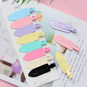 Set of macaron colored seamless metal hair clips for makeup and styling on a display card