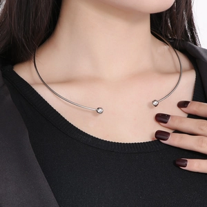 Detail of silver stainless steel choker featuring sparkling rhinestone beads on a model