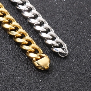 Close-up of gold and silver cuban link chains with sparkling diamonds for hip hop style