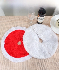 Macro view of plush red and white Christmas tree skirts with soft faux fur texture