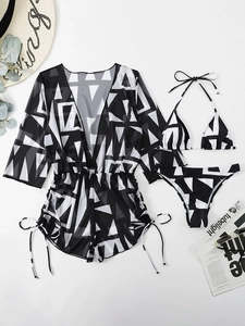 Detailed flat lay of a 3-piece swimwear set with black and white geometric patterns