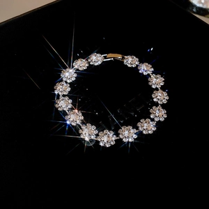 Detailed view of luxury silver flower bracelet with crystals and sparkling fire effect