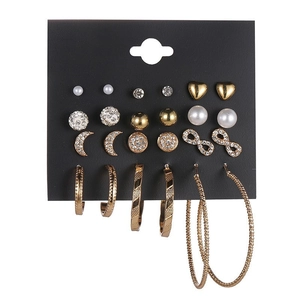 Set of 12 pairs gold moon star stud earrings and hoop earrings on display card