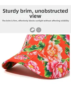 Detail of red floral hat featuring a stiff brim for clear vision and sun protection