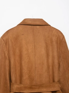 Detail view of caramel brown suede jacket back with collar stitching and waist belt
