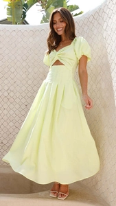 Close-up of summer dress featuring knot detail, hollow waist, and puff sleeves